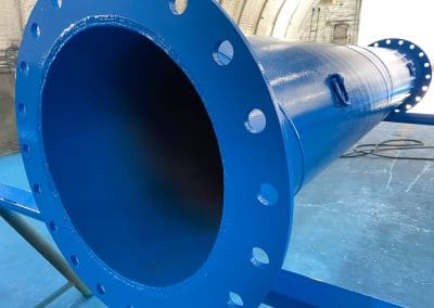 Photo of a high gloss blue paint on an industrial pipe