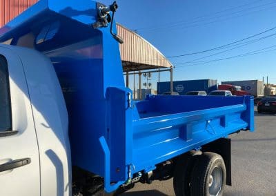 Completed blue paint job on a custom service truck bed